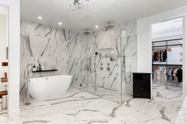 a bathroom with a bathtub and a shower