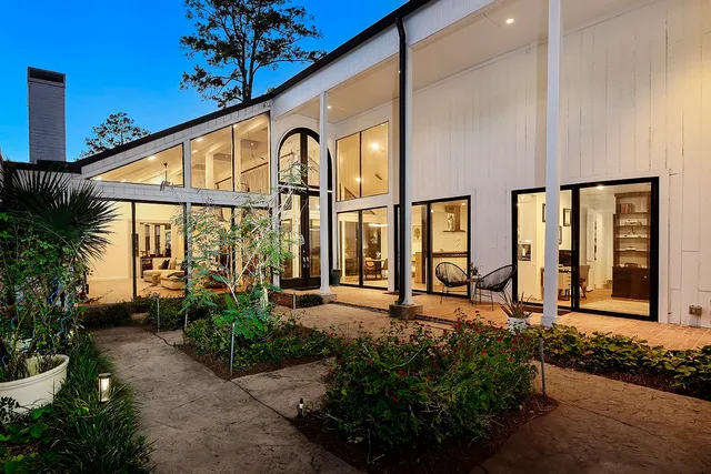 a view of a swimming pool with a lounge chairs