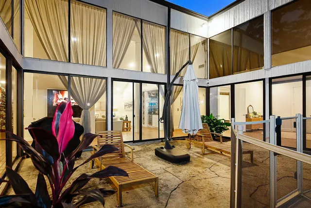 a view of swimming pool with outdoor seating