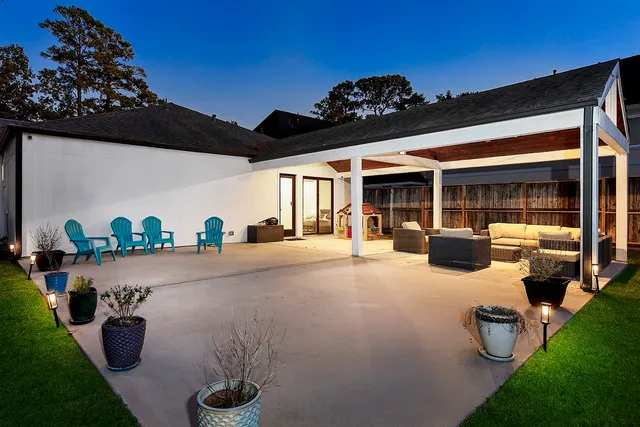 a outdoor living space with patio furniture and garden view
