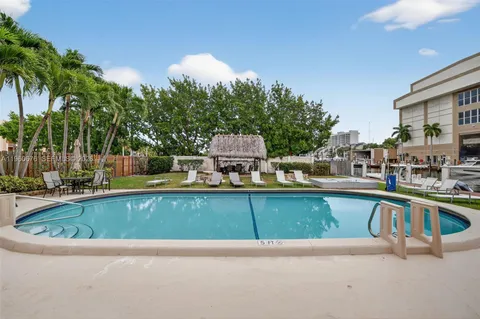 a view of a swimming pool with a lounge chair
