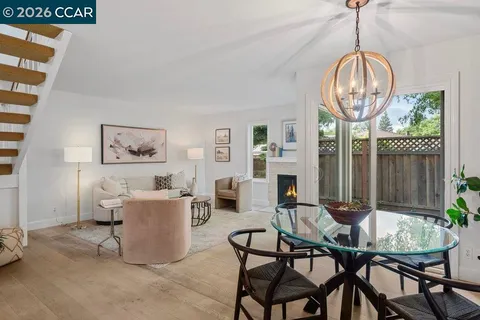 a living room with furniture and a painting
