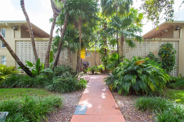 a view of a pathway both side of house