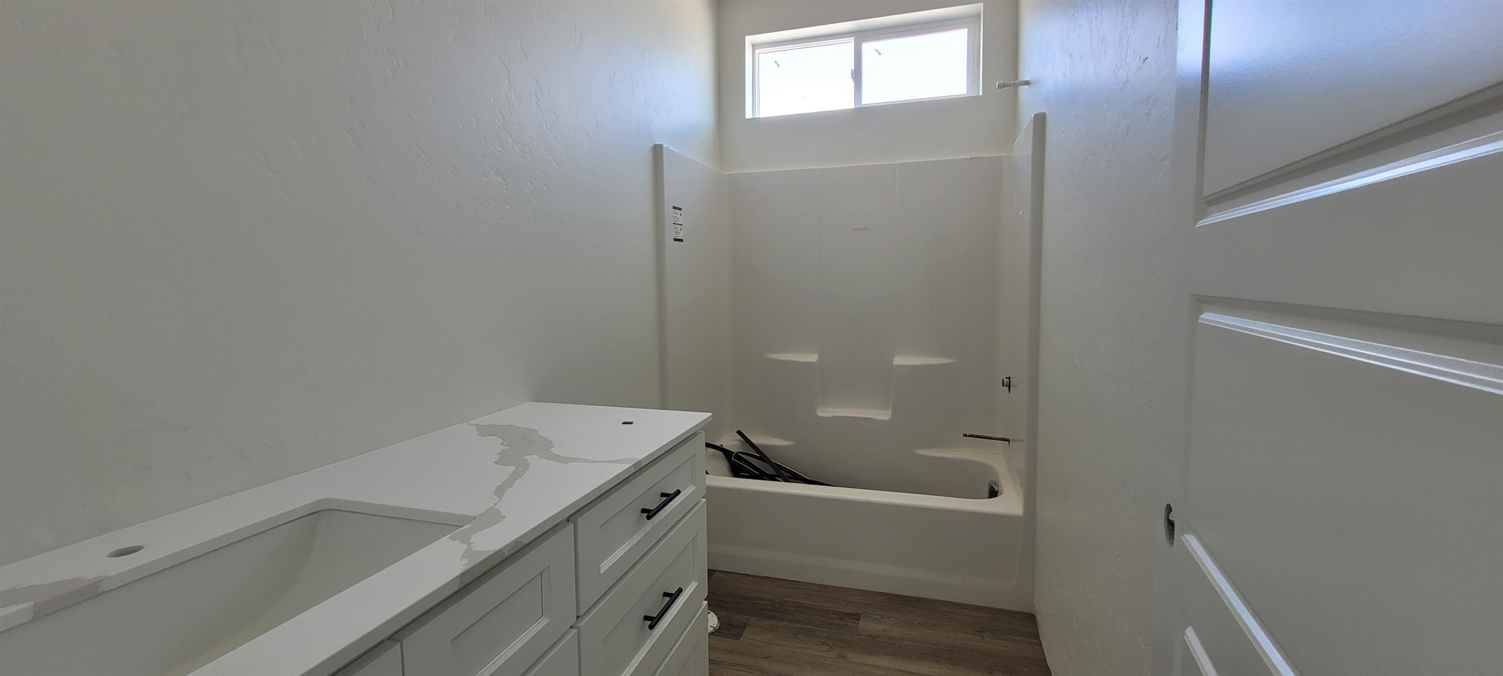 1644 Tungsten Way Fruita, CO 81521 - Photo 5 of 17 a bathroom with a bathtub sink and toilet