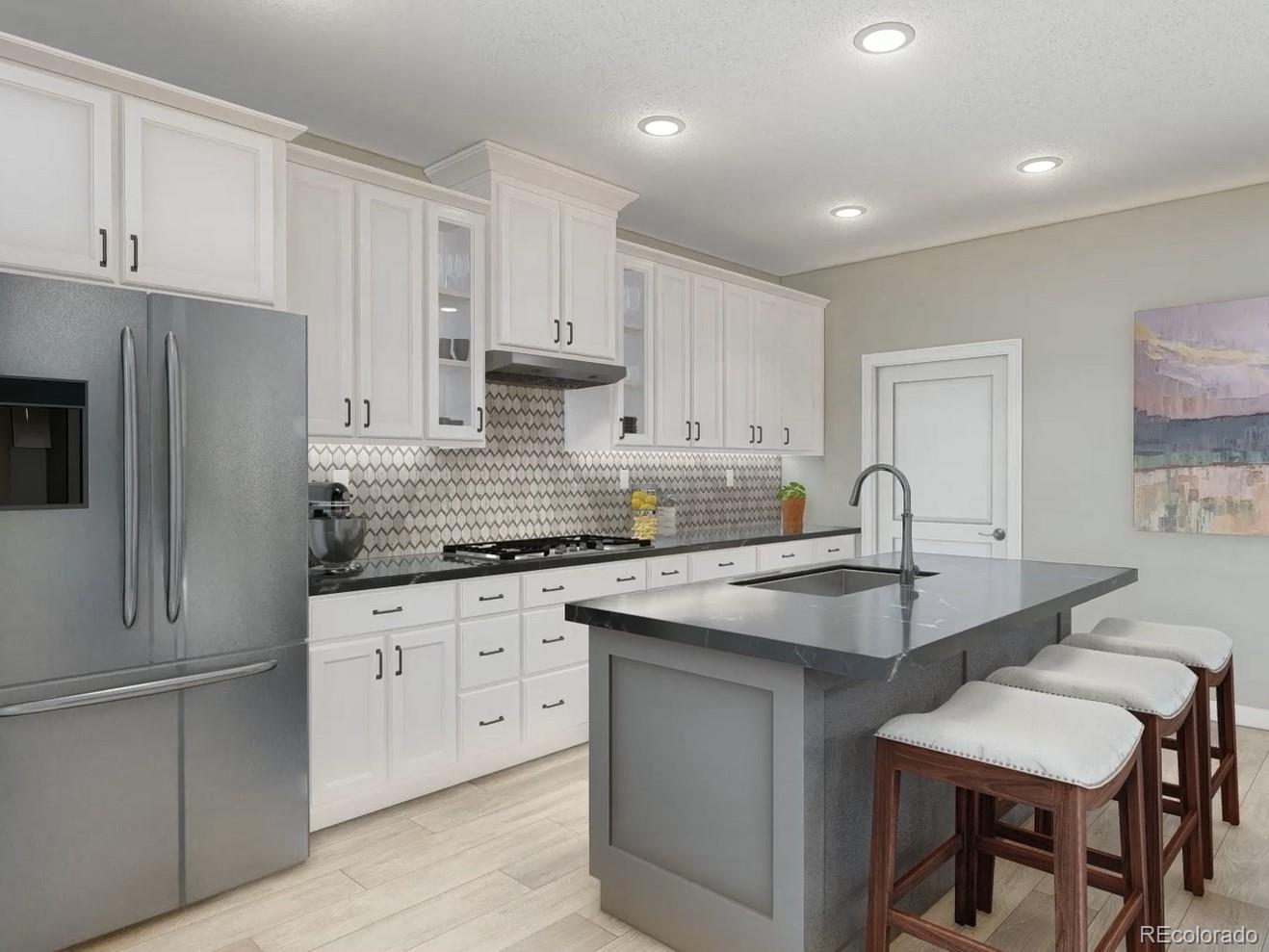 a kitchen with granite countertop white cabinets and stainless steel appliances