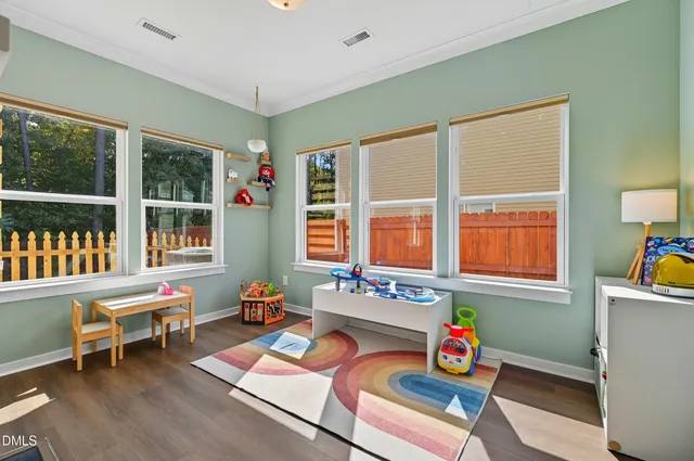 a living room filled with furniture and a window