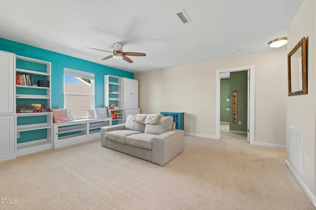 a living room with furniture and a en suite bathroom