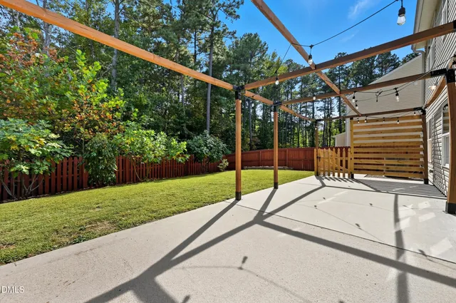 a view of a backyard with a small garden