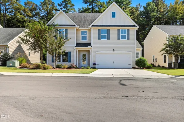 a view of multiple houses with a yard