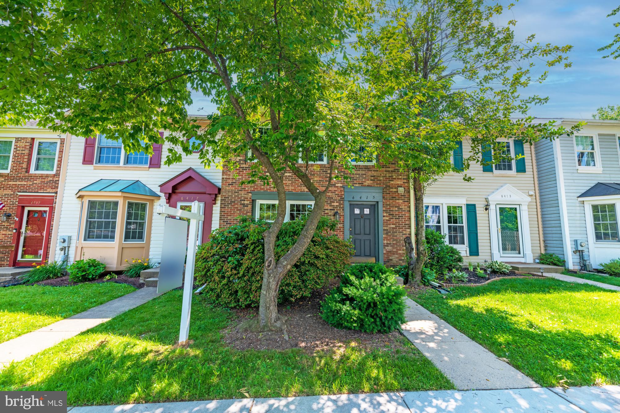 6415 Kelly Court Frederick, MD 21703 - Photo 1 of 22 a front view of a house with a yard
