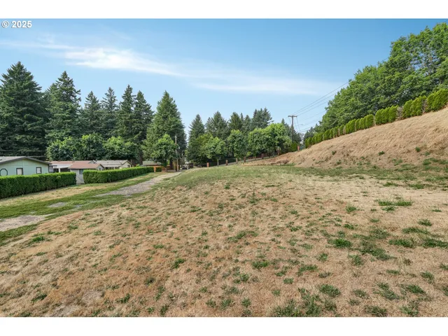 a view of a field with an outdoor space