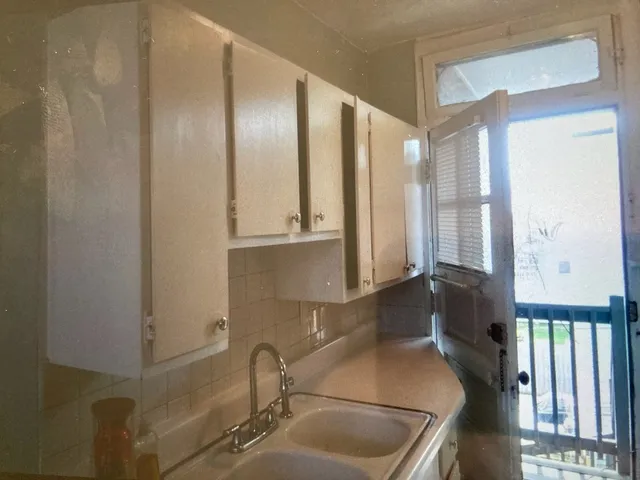 a kitchen with appliances and cabinets