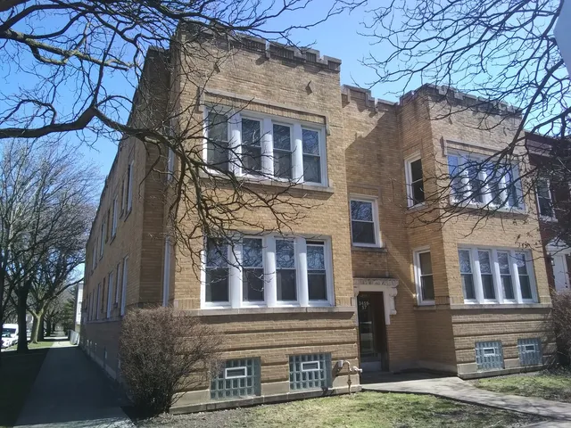 a kitchen with stainless steel appliances granite countertop a refrigerator sink and stove