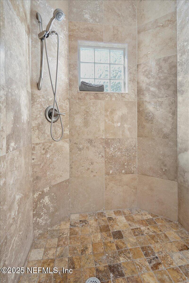 53 Menendez Road St. Augustine, FL 32080 - Photo 17 of 33 a bathroom with a shower