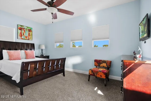 a bathroom with a granite countertop sink and a large mirror