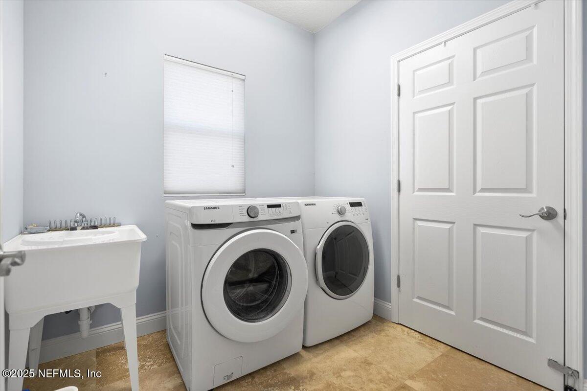 53 Menendez Road St. Augustine, FL 32080 - Photo 28 of 33 a utility room with dryer and washer