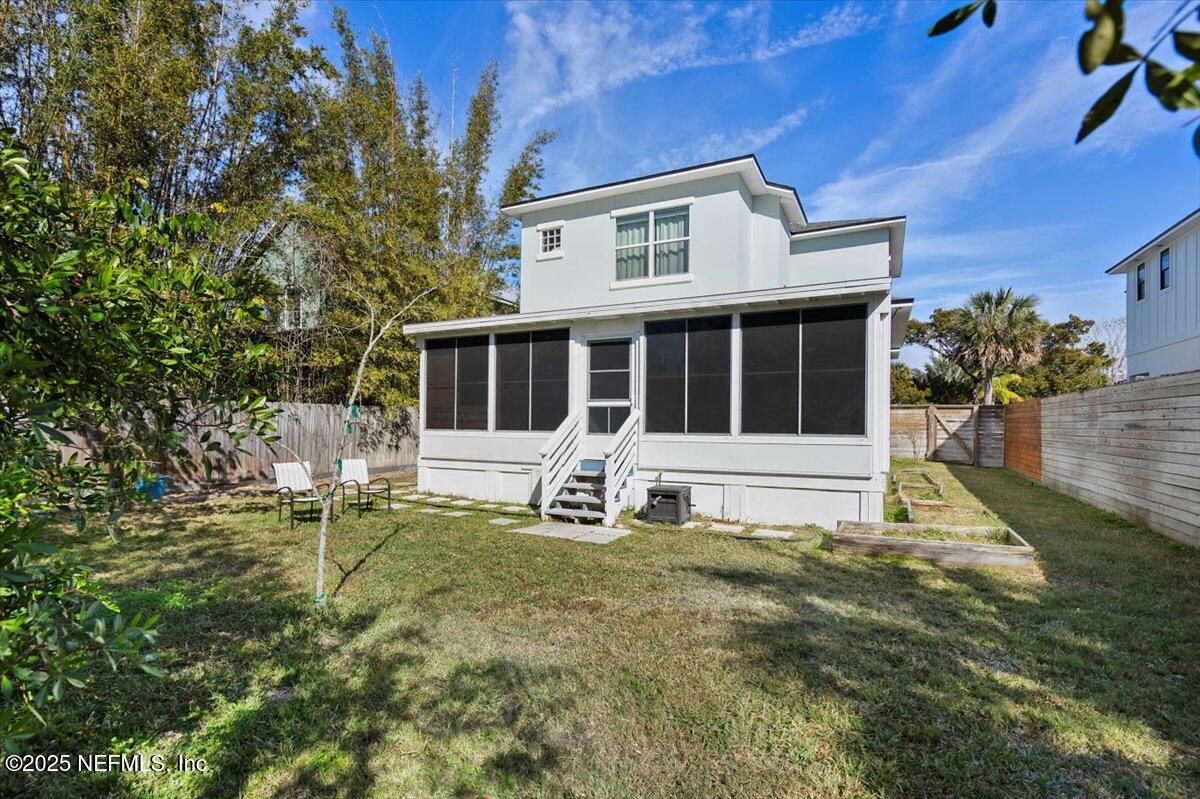 53 Menendez Road St. Augustine, FL 32080 - Photo 29 of 33 a house view with a sitting space and garden