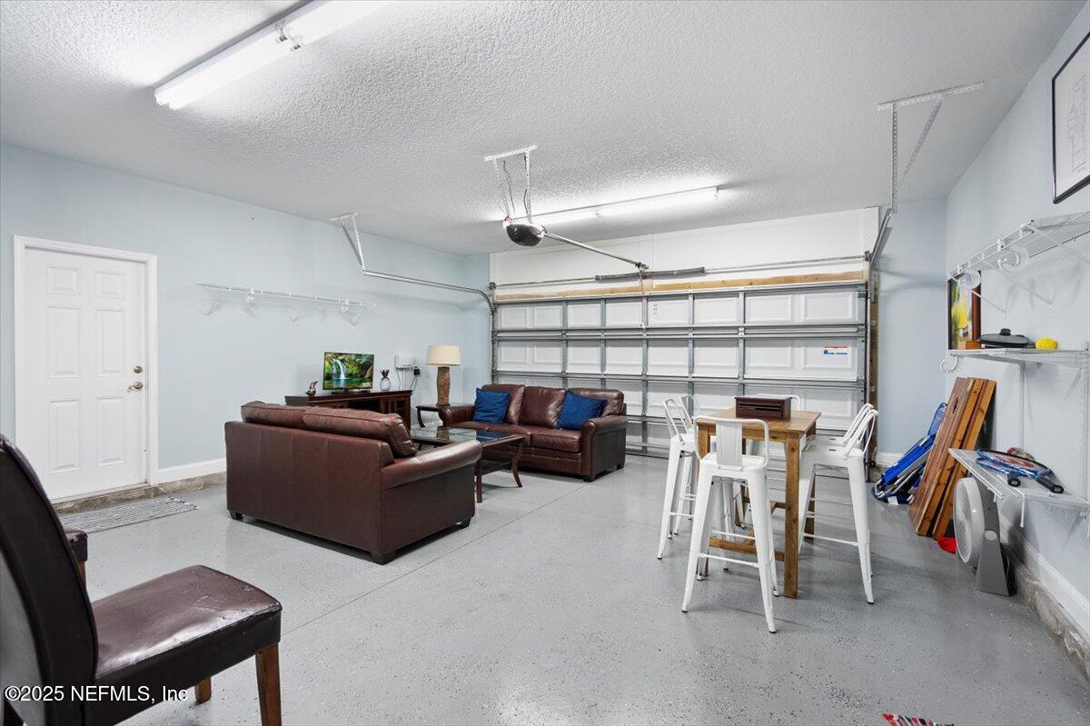 53 Menendez Road St. Augustine, FL 32080 - Photo 30 of 33 a living room with furniture and a flat screen tv