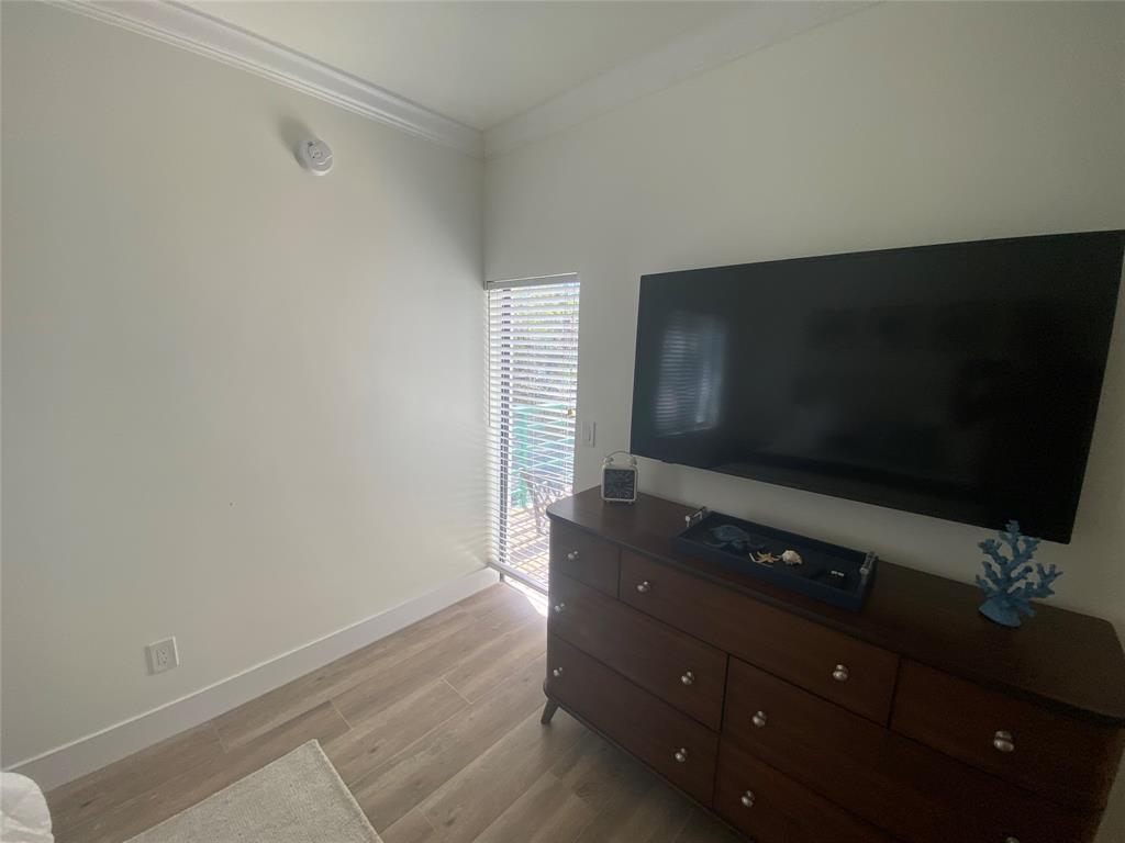 2286 Anchorage Lane, Unit A Naples, FL 34104 - Photo 19 of 41 a living room with furniture and a flat screen tv