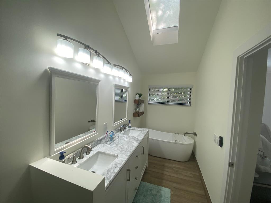 2286 Anchorage Lane, Unit A Naples, FL 34104 - Photo 22 of 41 a bathroom with a granite countertop sink and a mirror