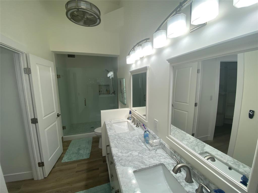 2286 Anchorage Lane, Unit A Naples, FL 34104 - Photo 23 of 41 a view of a hallway with furniture and wooden floor