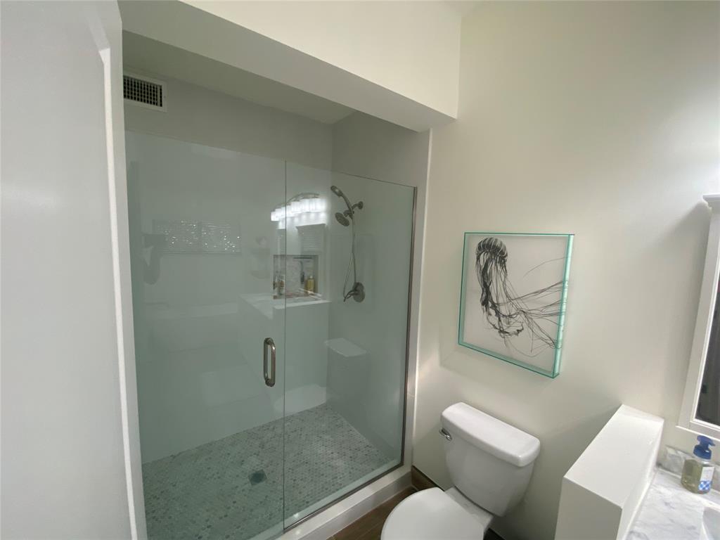 2286 Anchorage Lane, Unit A Naples, FL 34104 - Photo 24 of 41 a bathroom with a shower and toilet