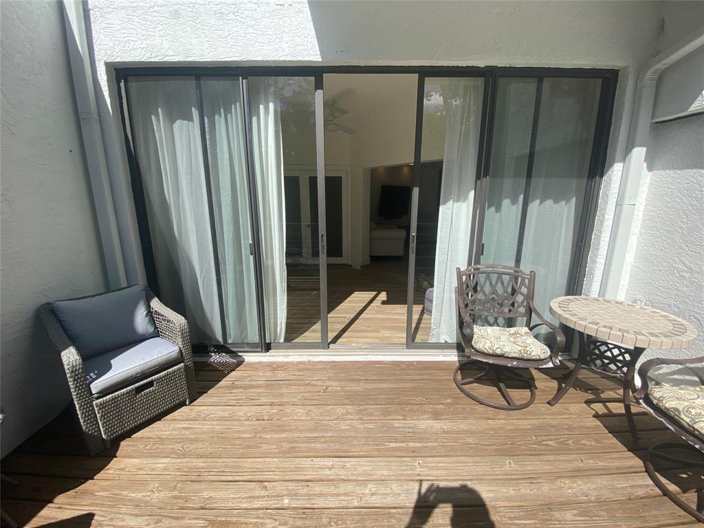 2286 Anchorage Lane, Unit A Naples, FL 34104 - Photo 30 of 41 a bedroom with a bed and a couch