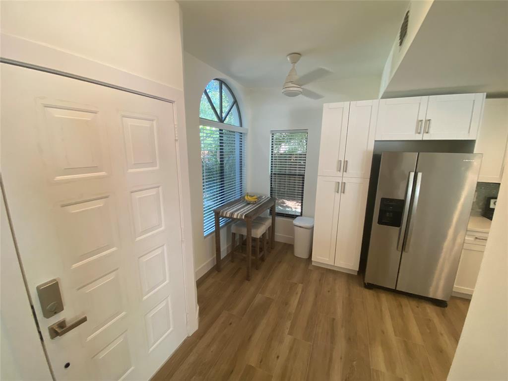 2286 Anchorage Lane, Unit A Naples, FL 34104 - Photo 7 of 41 a view of a kitchen from a hallway