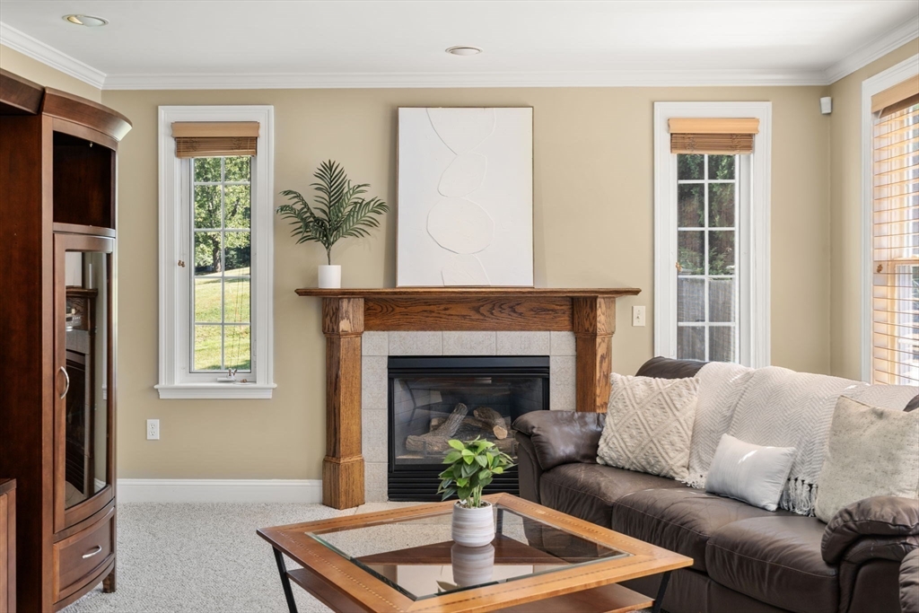 1 Austin Way Natick, MA 01760 - Photo 11 of 27 a living room with furniture and a fireplace