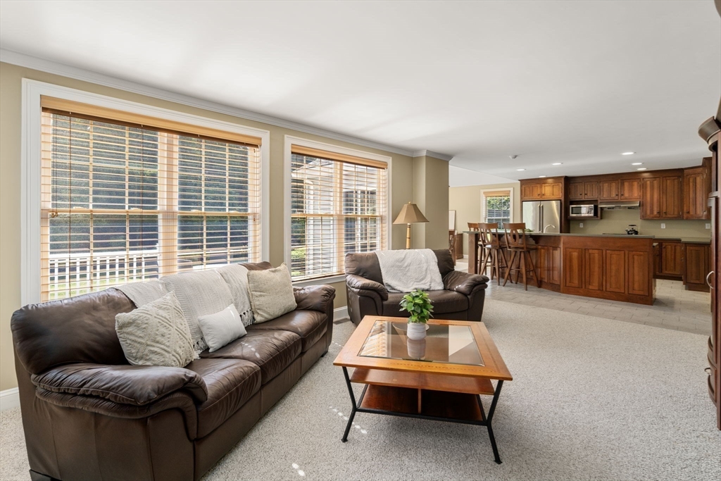 1 Austin Way Natick, MA 01760 - Photo 12 of 27 a living room with furniture and a large window