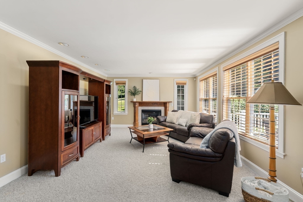 1 Austin Way Natick, MA 01760 - Photo 13 of 27 a living room with furniture and a fireplace