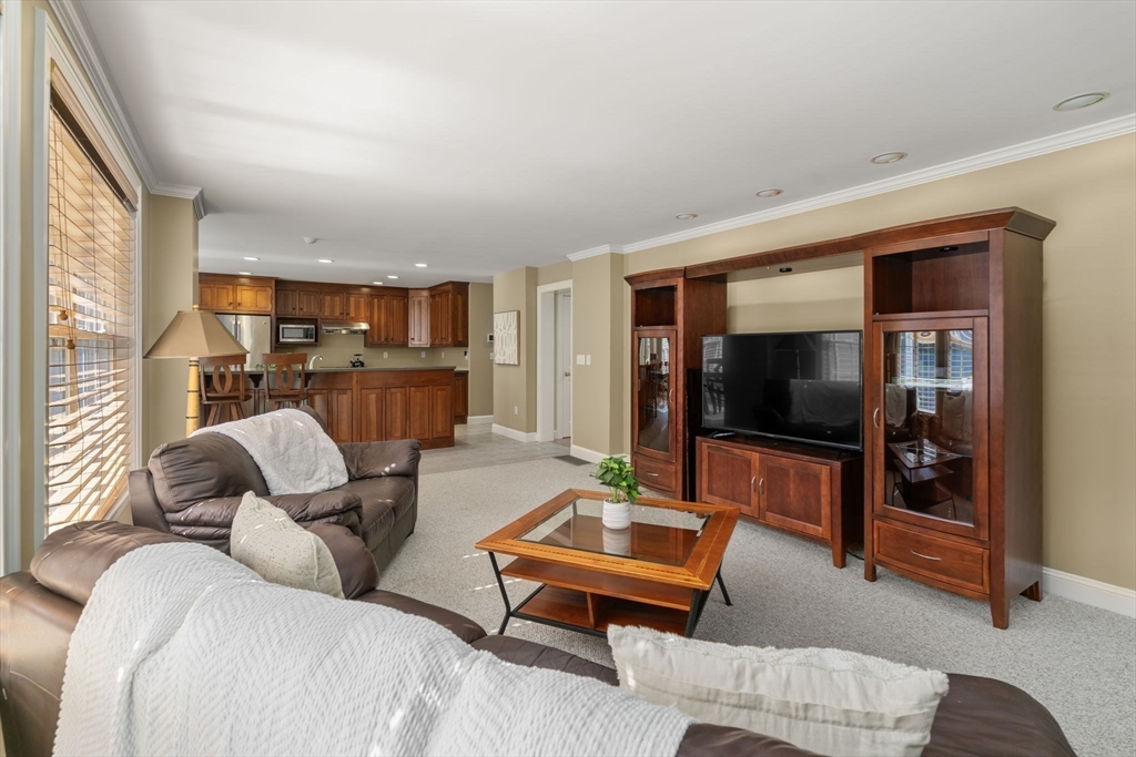 1 Austin Way Natick, MA 01760 - Photo 14 of 27 a living room with furniture and a flat screen tv