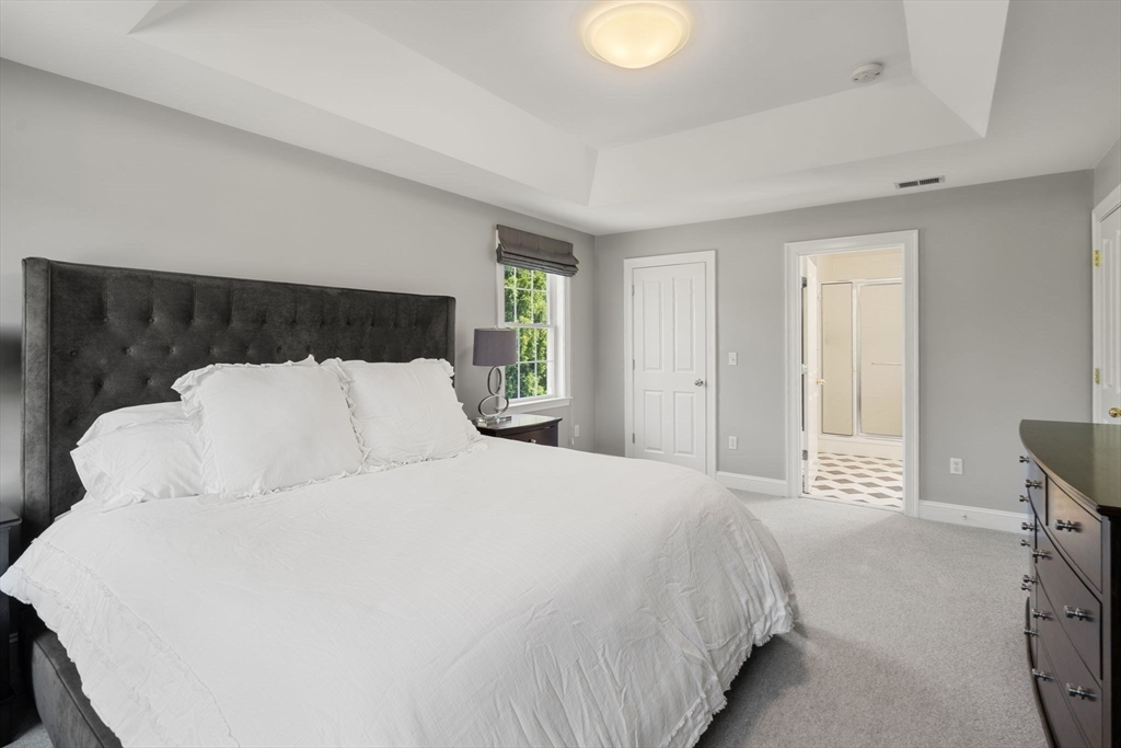 1 Austin Way Natick, MA 01760 - Photo 20 of 27 a large white bed in a white room