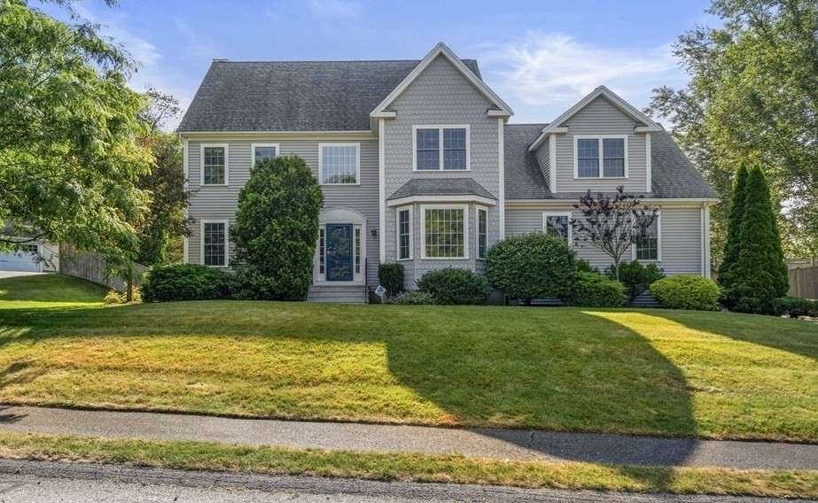 1 Austin Way Natick, MA 01760 - Photo 2 of 27 a front view of a house with garden