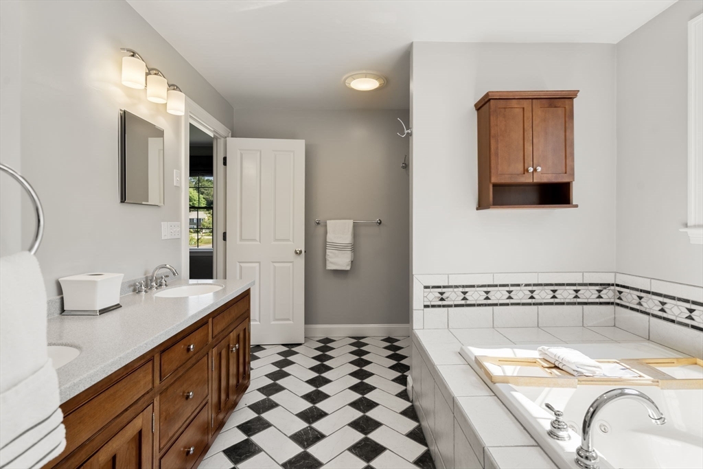 1 Austin Way Natick, MA 01760 - Photo 22 of 27 a bathroom with a bathtub and a sink
