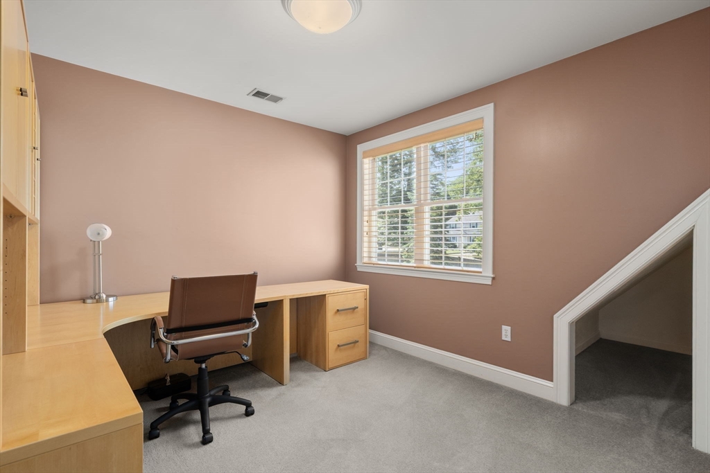 1 Austin Way Natick, MA 01760 - Photo 24 of 27 a view of a workspace with furniture and a window