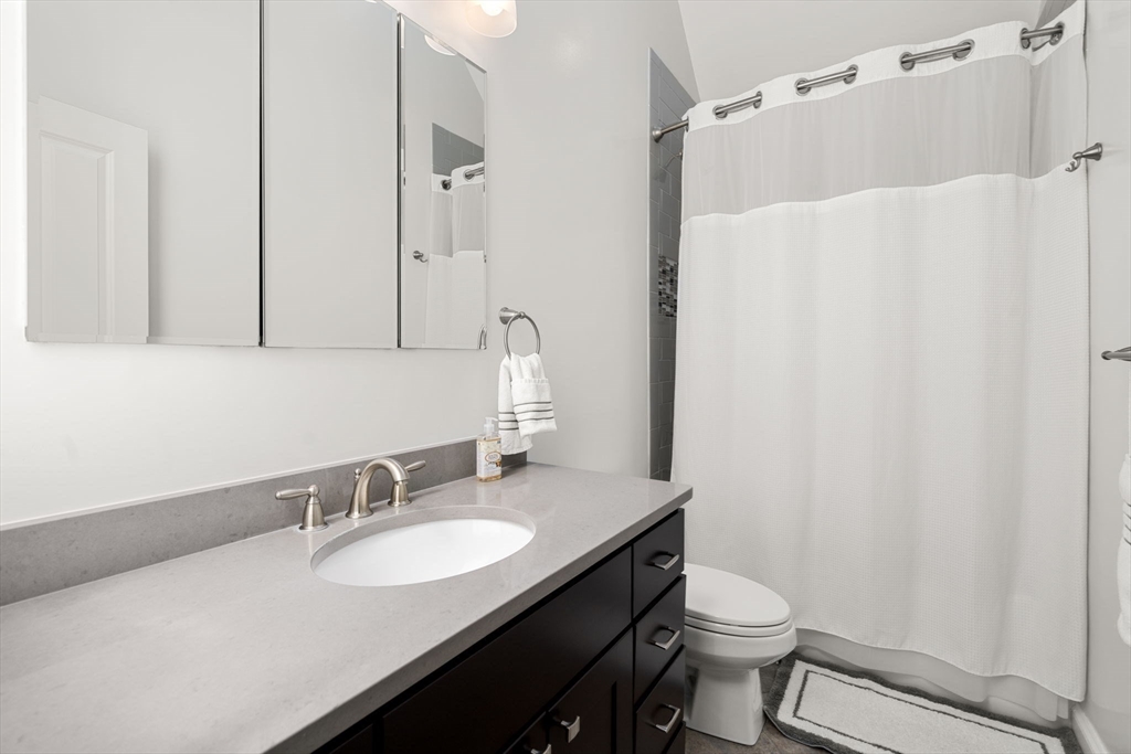 1 Austin Way Natick, MA 01760 - Photo 25 of 27 a bathroom with a sink toilet and shower