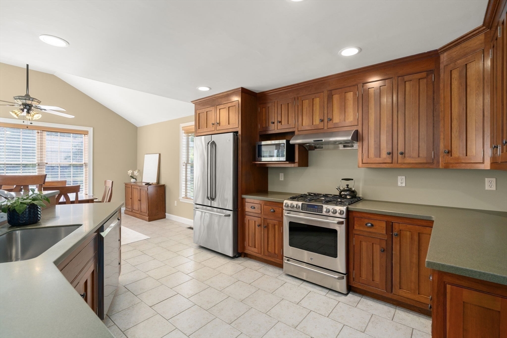 1 Austin Way Natick, MA 01760 - Photo 7 of 27 a kitchen with stainless steel appliances granite countertop a refrigerator stove and sink