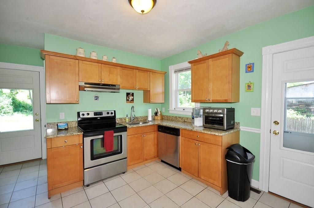 28 Ayer Road Shirley, MA 01464 - Photo 14 of 20 a kitchen with stainless steel appliances a stove sink and microwave