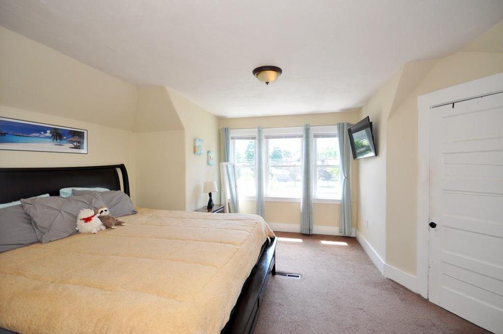 28 Ayer Road Shirley, MA 01464 - Photo 17 of 20 a bedroom with a large bed and a large window