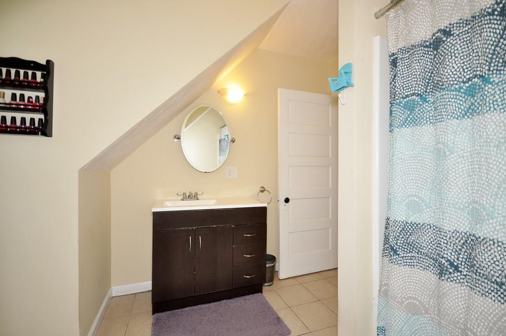 28 Ayer Road Shirley, MA 01464 - Photo 18 of 20 a bathroom with a sink and a mirror