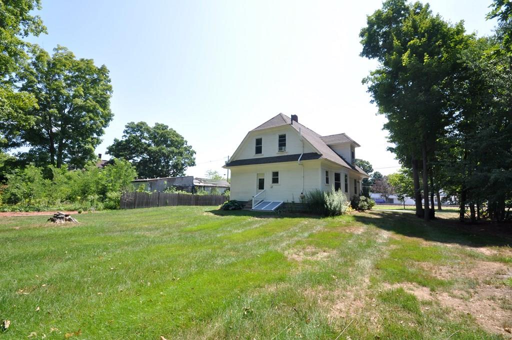28 Ayer Road Shirley, MA 01464 - Photo 20 of 20 a view of a house with a big yard and large trees