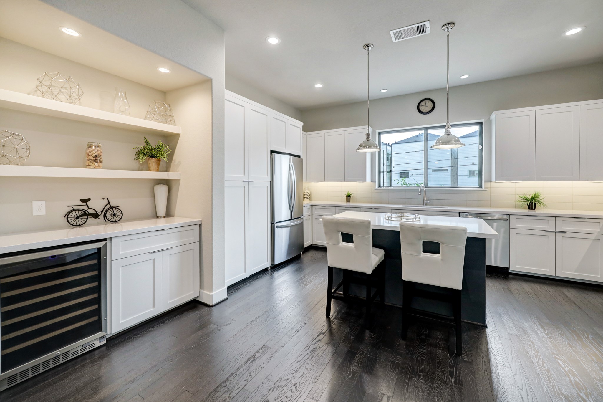 4203 Allen Street Houston, TX 77007 - Photo 16 of 35 a kitchen with stainless steel appliances kitchen island granite countertop a table chairs sink and cabinets