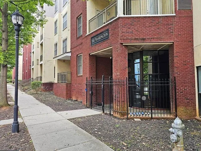 a view of a brick building with a large door