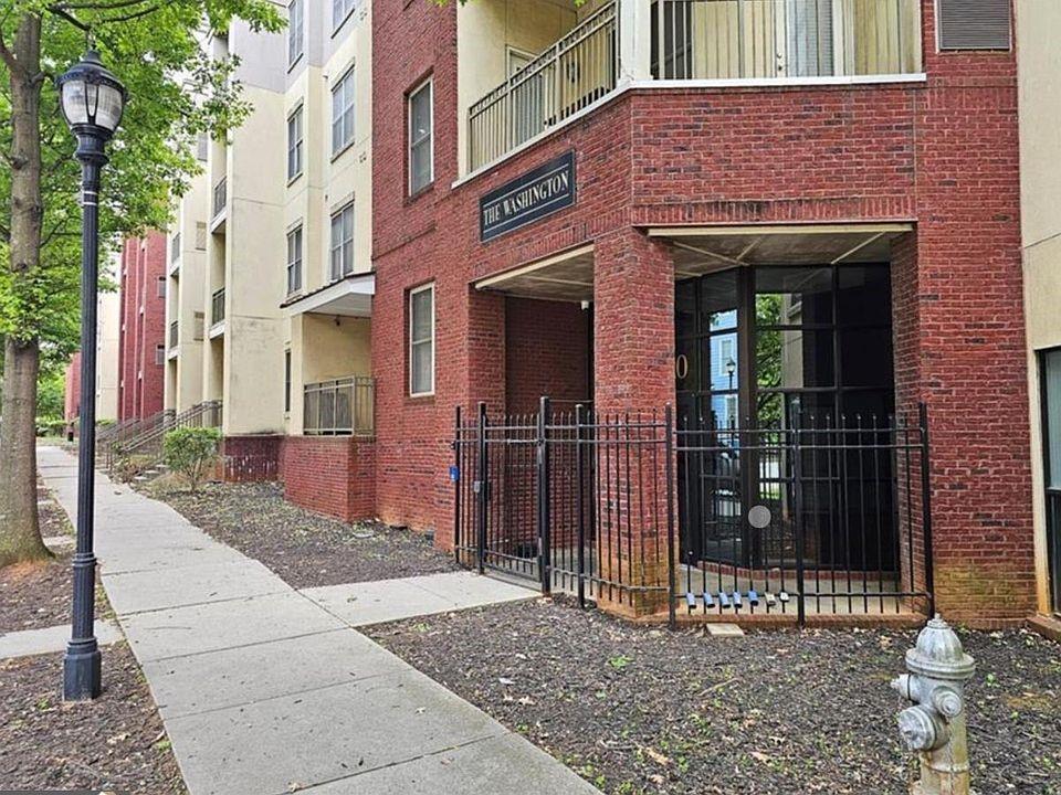 a view of a brick building with a large door