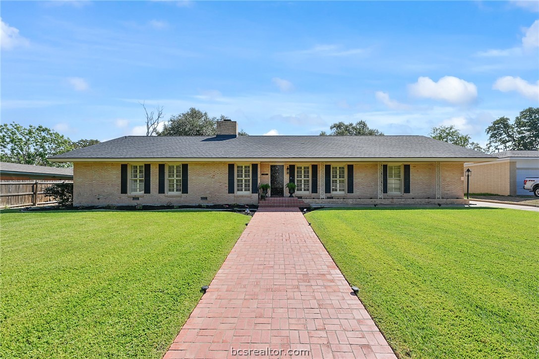 109 Greenway Drive Bryan, TX 77801 - Photo 1 of 1 a view of a big yard with a house in the background