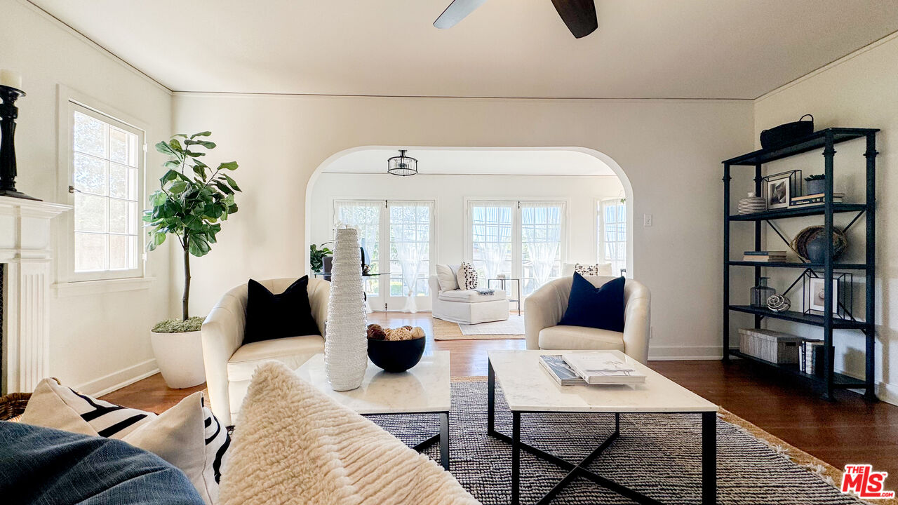 13529 Beverly Boulevard Whittier, CA 90601 - Photo 11 of 54 a living room with furniture hard wood floor and a flat screen tv