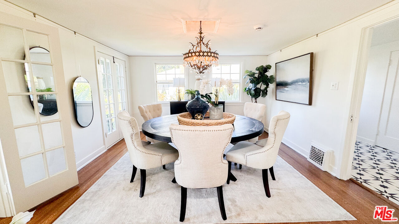 13529 Beverly Boulevard Whittier, CA 90601 - Photo 15 of 54 a dining room with furniture window and wooden floor