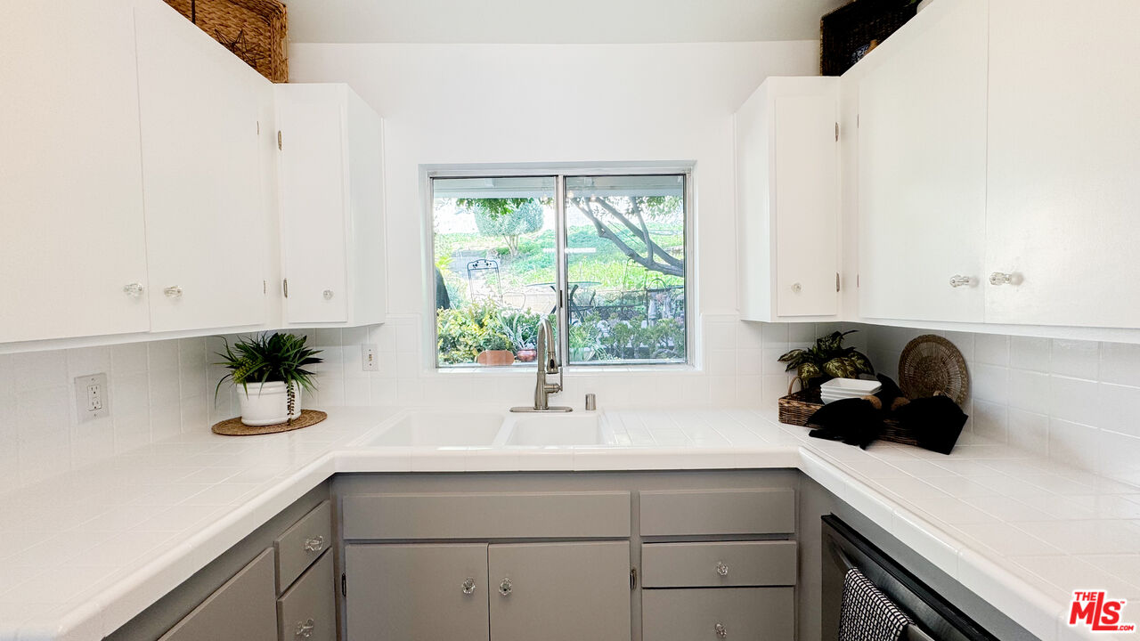 13529 Beverly Boulevard Whittier, CA 90601 - Photo 19 of 54 a sink a window and potted plant