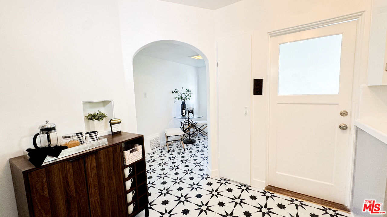 13529 Beverly Boulevard Whittier, CA 90601 - Photo 20 of 54 a view of a hallway to a livingroom with furniture